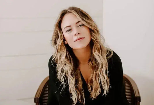 Woman with wavy blonde hair representing the inspiring cover of Brianna Wiest’s books Woman with wavy blonde hair representing the inspiring cover of Brianna Wiest’s books