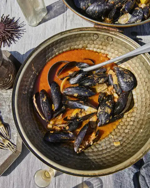 Mussels in rich reddish-orange sauce from A Game of Thrones Official Cookbook Mussels in rich reddish-orange sauce from A Game of Thrones Official Cookbook