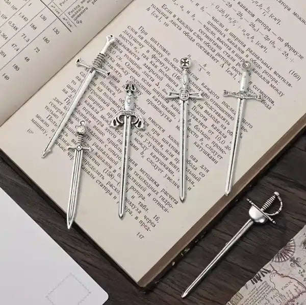 Antique silver finish metal sword bookmark with sword-shaped design for book lovers Antique silver finish metal sword bookmark with sword-shaped design for book lovers