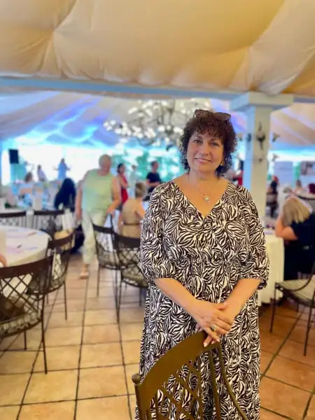 Woman in black and white patterned maxi dress from How to Nurture a Love of Reading in Children by Coach Valentyna Melnyk Woman in black and white patterned maxi dress from How to Nurture a Love of Reading in Children by Coach Valentyna Melnyk
