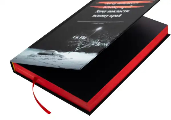 Black hardcover book with red page edges and ribbon bookmark from Iain Reid psychological thriller books Black hardcover book with red page edges and ribbon bookmark from Iain Reid psychological thriller books