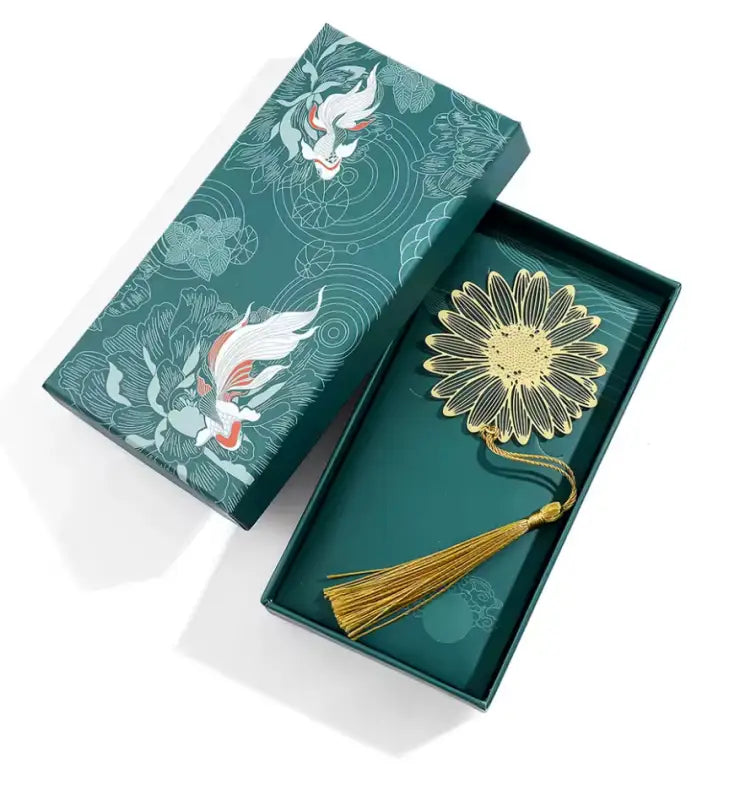 Green gift box with gold flower tassel bookmark and tassel bookmark, elegant brass floral design Green gift box with gold flower tassel bookmark and tassel bookmark, elegant brass floral design