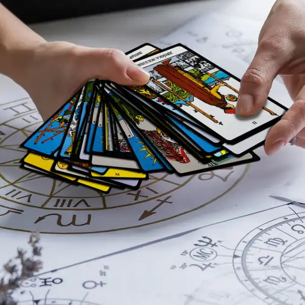 Hand holding Ukrainian edition tarot cards Rider–Waite with guidebook Hand holding Ukrainian edition tarot cards Rider–Waite with guidebook