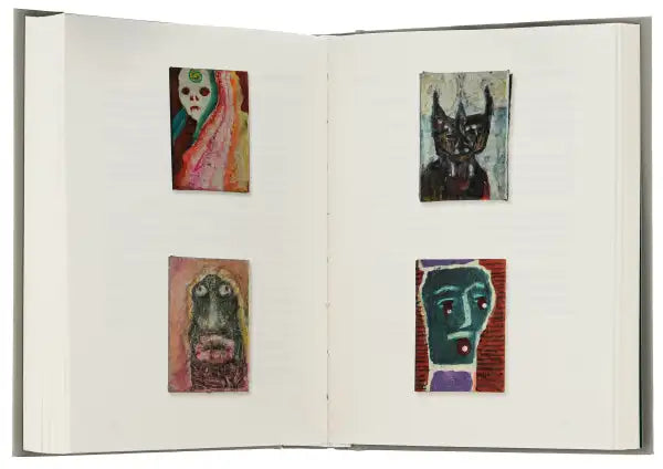Open sketchbook with four small paintings by Yurii Izdryk showcasing The Third Paradise art books Open sketchbook with four small paintings by Yurii Izdryk showcasing The Third Paradise art books