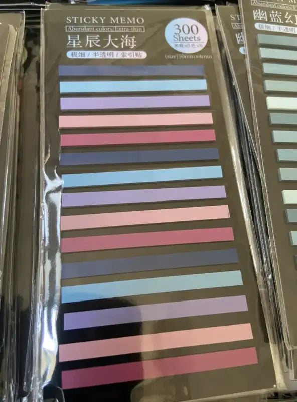 Colorful transparent sticky tabs in purple pink and blue for books and notes Colorful transparent sticky tabs in purple pink and blue for books and notes