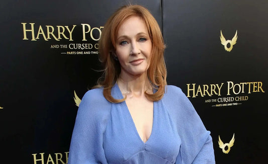Red-haired woman in a blue dress representing J.K. Rowling, creator of Harry Potter books