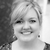 Smiling woman with styled hair from the Colleen Hoover collection featuring English books