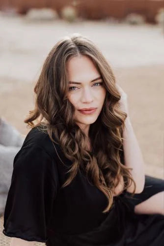 Brunette woman with wavy hair from the Brianna Wiest book collection featuring English books