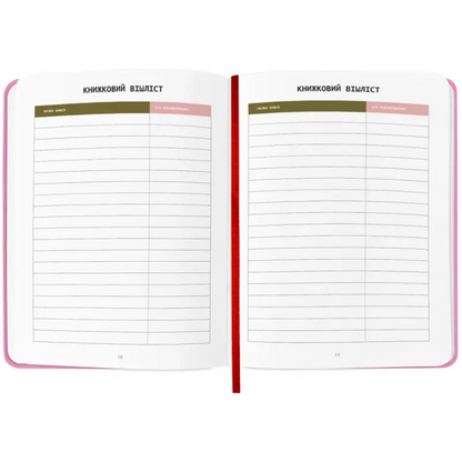 Open pink Book Lovers Club Reading Journal with lined pages for note-taking