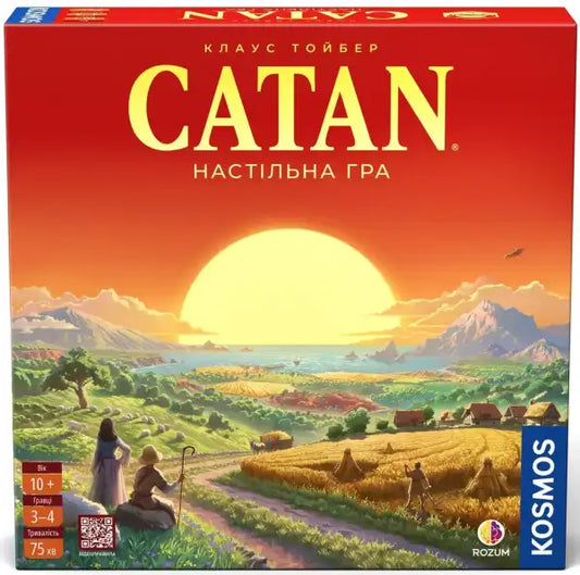 Red Catan strategy board game box with sunset over green hills and mountains