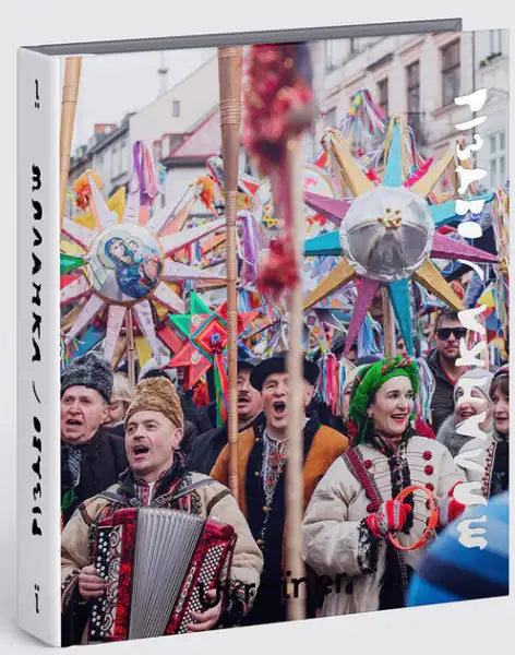 Book cover of Bohdan Logvinenko’s Ukrainian edition celebrating Ukrainian winter traditions with star decorations