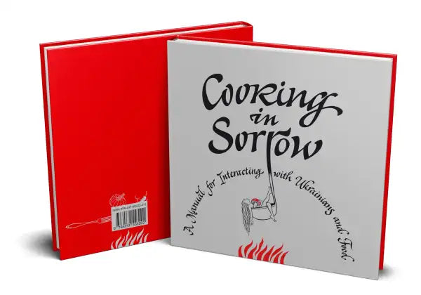 Red and white hardcover book on Ukrainian culture and identity titled Cooking in Sorrow