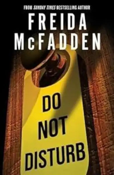 Yellow door hanger with black border from Freida McFadden books in English paperback 2025