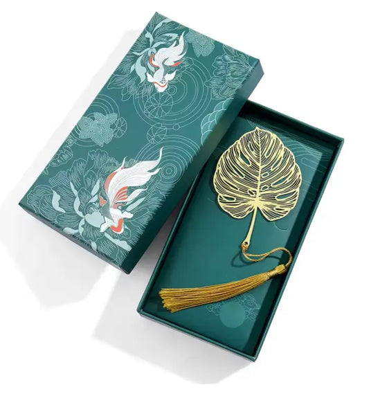 Metal flower tassel bookmark with leaf-shaped metal design in decorative box