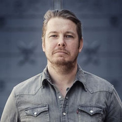 Man with light brown hair in gray shirt from Fredrik Backman collection of English books