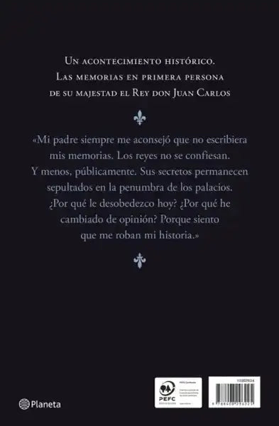 Black hardcover book by Juan Carlos, Editorial Planeta, with blue fleur-de-lis