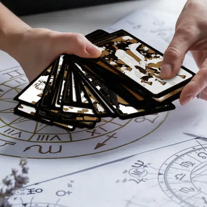 Black and gold tarot cards from The Golden Deck – Orner Ukrainian Edition with upright reversed meanings